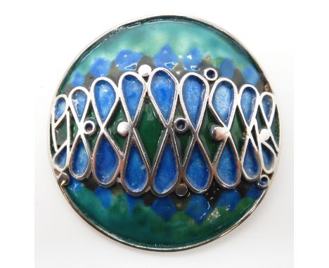 A white metal and enamel brooch in the manner of Norman Grant, no hallmarks Condition Report: Not available for this lot