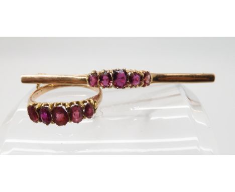 A yellow metal ruby ring size L, with similar brooch, weight 4.1gms Condition Report: Available upon request
