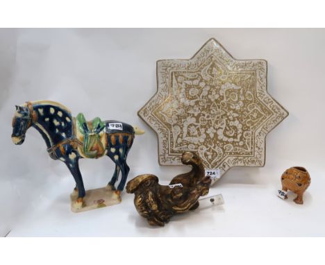 A giltwood kylin, a Islamic star tile, a pottery grotesque brush washer and a tang style horse Provenance - The Estate of the