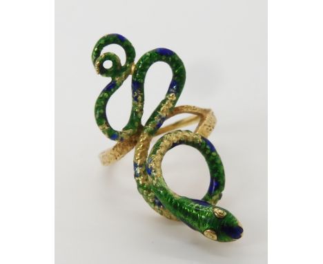 A bright yellow metal enamelled snake ring stamped 750, size M, (enamel af) weight 5.8gms Condition Report: Available upon re