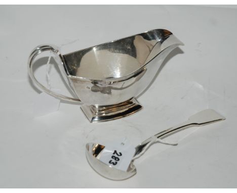 A lot comprising an Art Deco silver sauce boat, Birmingham 1930 and a sauce ladle, London 1825, 270gms Condition Report: Avai