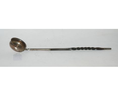 A silver bowled toddy ladle with whalebone handle, unclear London marks, 40cm long Condition Report: Available upon request