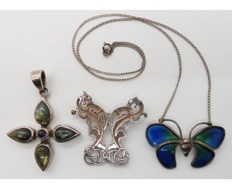 A silver and enamel Pat Cheney butterfly necklace, a mythical beasts brooch and a labradorite cross pendant Condition Report: