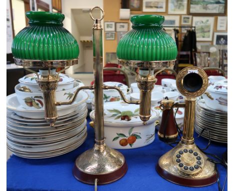 A Thomas Alva Edison commemorative brass twin light desk lamp with opaque green glass shades, and a Alexander Graham Bell com