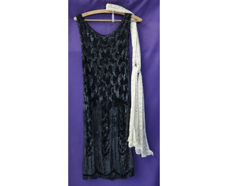 A 1920's Egyptian Assuit cream shawl, a bead and sequin flapper dress, a swimsuit, a fine mesh skirt, black lace dress, cream