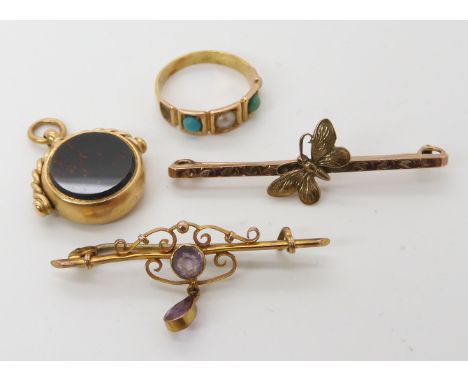 A 9ct bar brooch with a butterfly motif, a 9ct amethyst example, a 9ct agate swivel fob weight combined 10.7gms and a bright 