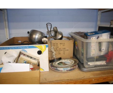 A shelf containing wool, stamps, china etc.