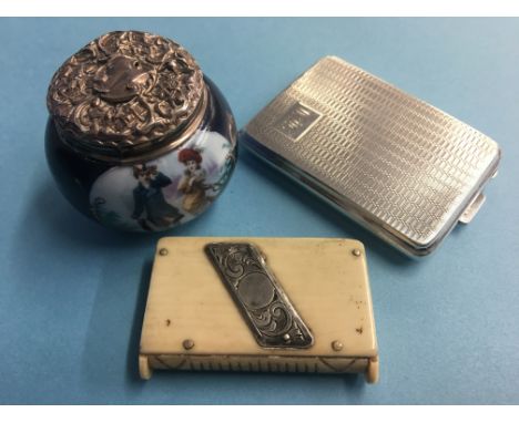 A small engine turned silver case, a silver top bottle and a bone vesta case (3)