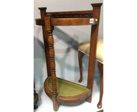 An oak Barum furniture half moon stick stand