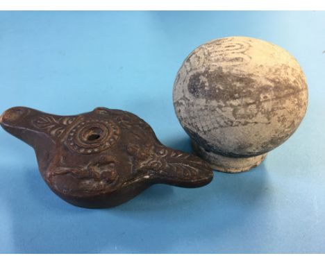 An early terracotta oil lamp and a Corinthian aryballos (2)