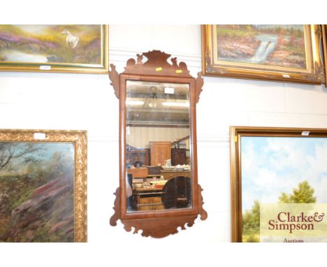 A mahogany Chippendale style fret carved wall mirror 