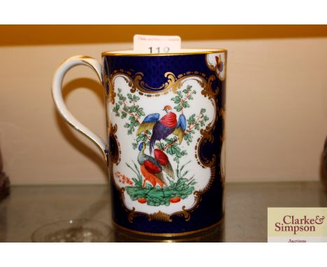 A Worcester style mug, having painted panel decoration of birds and butterflies on a blue scale ground AF 