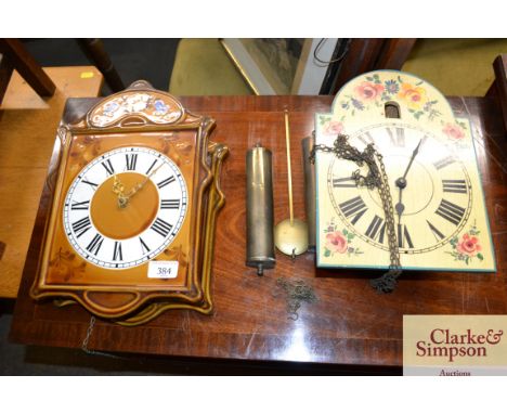 A pottery wall clock and matching mirror; and a painted wall clock 