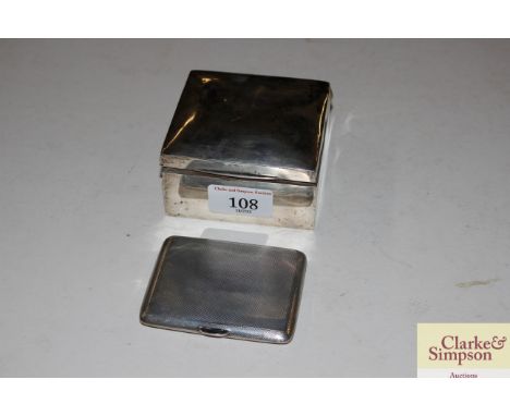 A silver cigarette box; and a silver engine turned cigarette case, 2.5oz