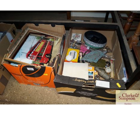 A box of miscellaneous items to include a small cased clock, china, cameras etc.; and a box of miscellaneous photographic pri