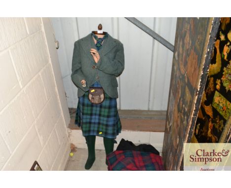 A vintage Boy Mannequin dressed in Scottish costume with accessories 