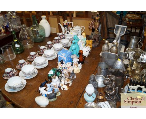 A collection of various pottery and other ornaments, including Poole dolphins 