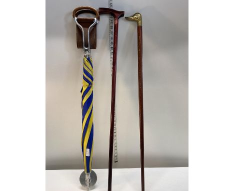 A vintage shooting stick and two walking sticks 