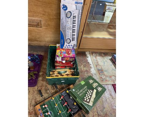 A selection of vintage board games including table top football and a electric keyboard, shipping unavailable 