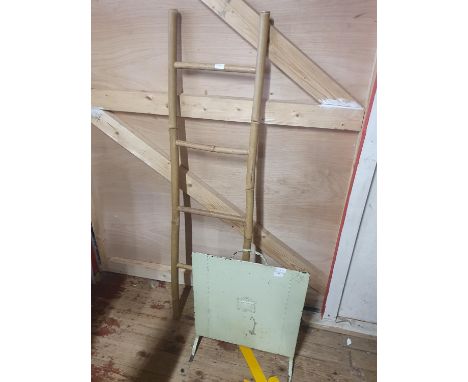 A antique metal firescreen and a bamboo ladder (h150cm), shipping unavailable