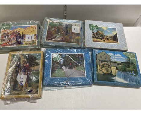 A box full of assorted vintage Victory puzzles (unchecked) 