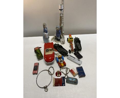 A box of assorted collectables including a Nao lamp base, shipping unavailable 