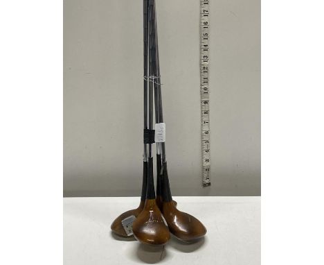 Four vintage wooden golf clubs, shipping unavailable 