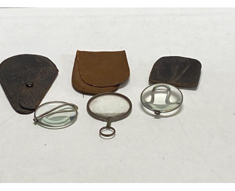 Three vintage magnifying glasses 