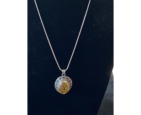 A vintage 925 silver and amber pendant on silver chain 