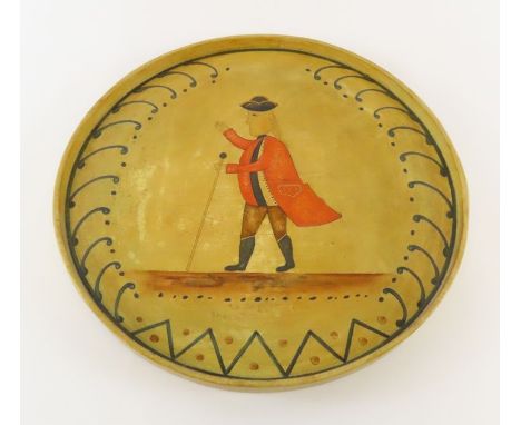 A circular painted wood tray with naïve portrait of a 19th century gentleman in red coat 44cm diam