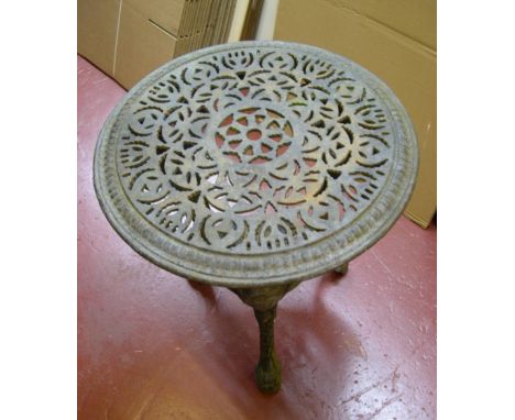 Vintage cast iron circular garden table, compete with original patina.68 cm high by 60cm diameter table top. 