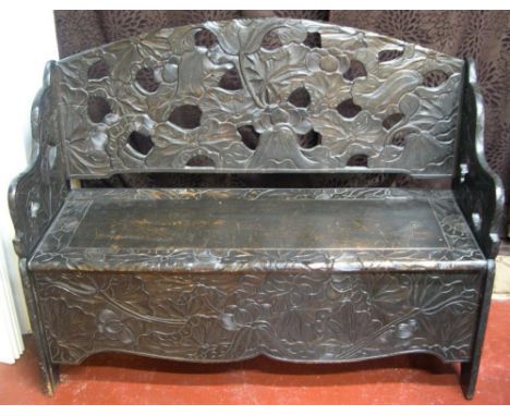 Superbly carved Victorian hardwood monks bench, carved with stylised flowers.126 cm in length 