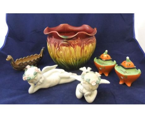 5 ceramic items including a pair of unmarked 20thC putti and a wade longboat etc 