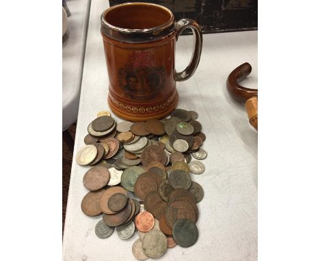 A CERAMIC TANKARD COMMEMORATING THE MARRIAGE OF HRH PRINCE OF WALES AND LADY DIANA SPENCER, FILLED WITH OLD COINS 