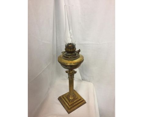 A TALL BRASS LAMP WITH CLEAR GLASS FUNNEL 