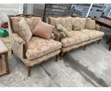 A TWO SEATER SOFA AND ARMCHAIR ON MAHOGANY CABRIOLE SUPPORTS 