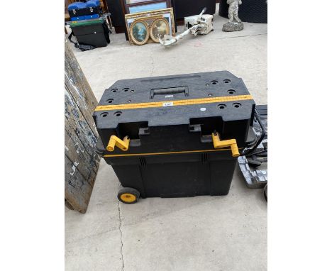 A TWO WHEELED PLASTIC TOOL BOX WITH WORK BENCH TOP 
