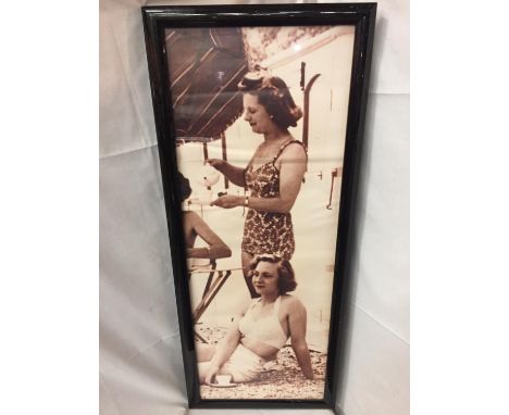 A LARGE BLACK FRAMED 1940'S STYLE PRINT OF LADIES HAVING TEA 114CM X 47CM 