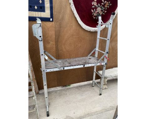 AN ALLUMINIUM MULTI POSITION LADDER WITH A DECORATORS PLATFORM 