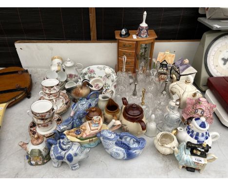 A LARGE ASSORTMENT OF GLASS AND CERAMIC WARE TO INCLUDE BELLS, JUGS AND ROYAL ALBERT CUPS ETC 