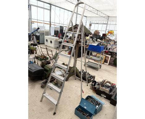 A SIX RUNG ALLUMINIUM STEP LADDER AND A LONG REACH GARDEN LOPPER 