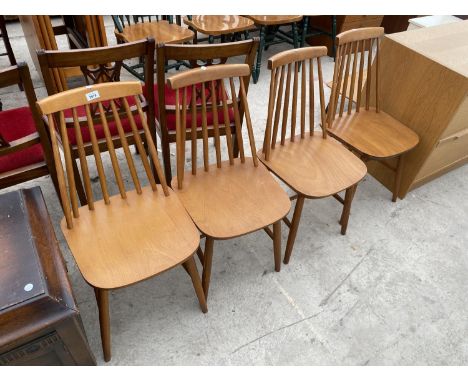 A SET OF FOUR ERCOL STYLE SPINDLE BACK DINING CHAIRS 