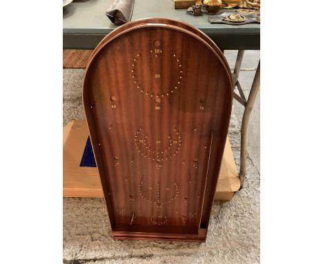 A NEW AND BOXED BAGATELLE BOARD WITH BALLS 