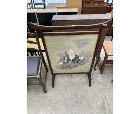 AN OAK FRAMED ORIENTAL STYLE FIRESCREEN BEARING LIBERTY LONDON LABEL 