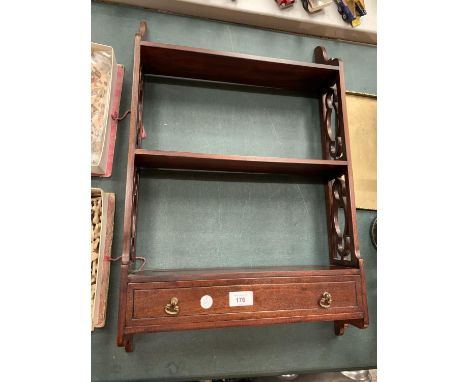 A MAHOGANY WALL HANGING DISPLAY SHELF WITH LOWER DRAW 