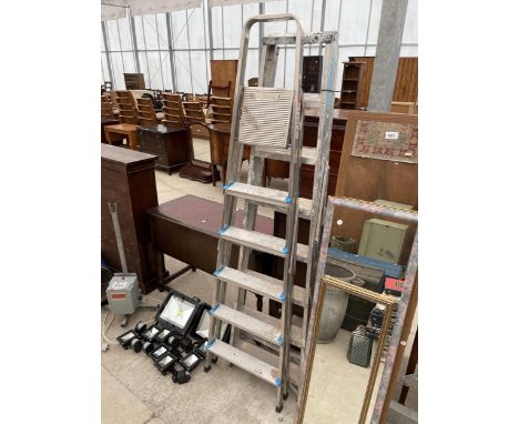 A SEVEN RUNG ALLUMINIUM STEP LADDER AND A FURTHER FIVE RUNG ALLUMINIUM STEP LADDER 