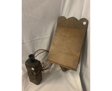 A VINTAGE WALL MOUNTED LECTURN AND A CARVED LAMP BASE 