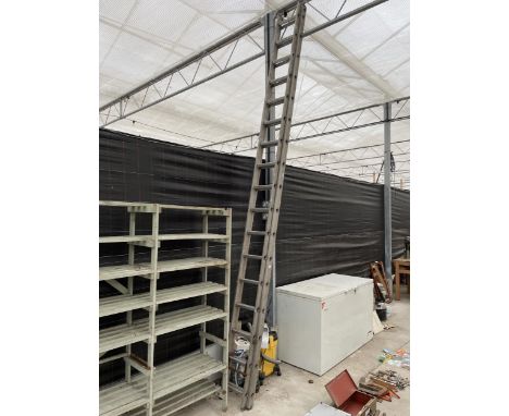 AN ALLUMINIUM EXTENDING LADDER (34 RUNG TOTAL) 