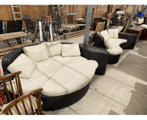 TWO RATTAN EFFECT PATIO SETTEES AND A POUFFE 