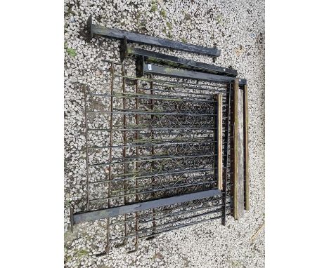 FOUR SECTIONS OF WROUGHT IRON FENCING, A WROUGHT IRON GATE AND FOUR POSTS 